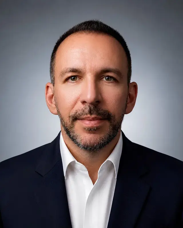 Portrait of Bjorn Laku, Director and CMO of Cashbook Finance